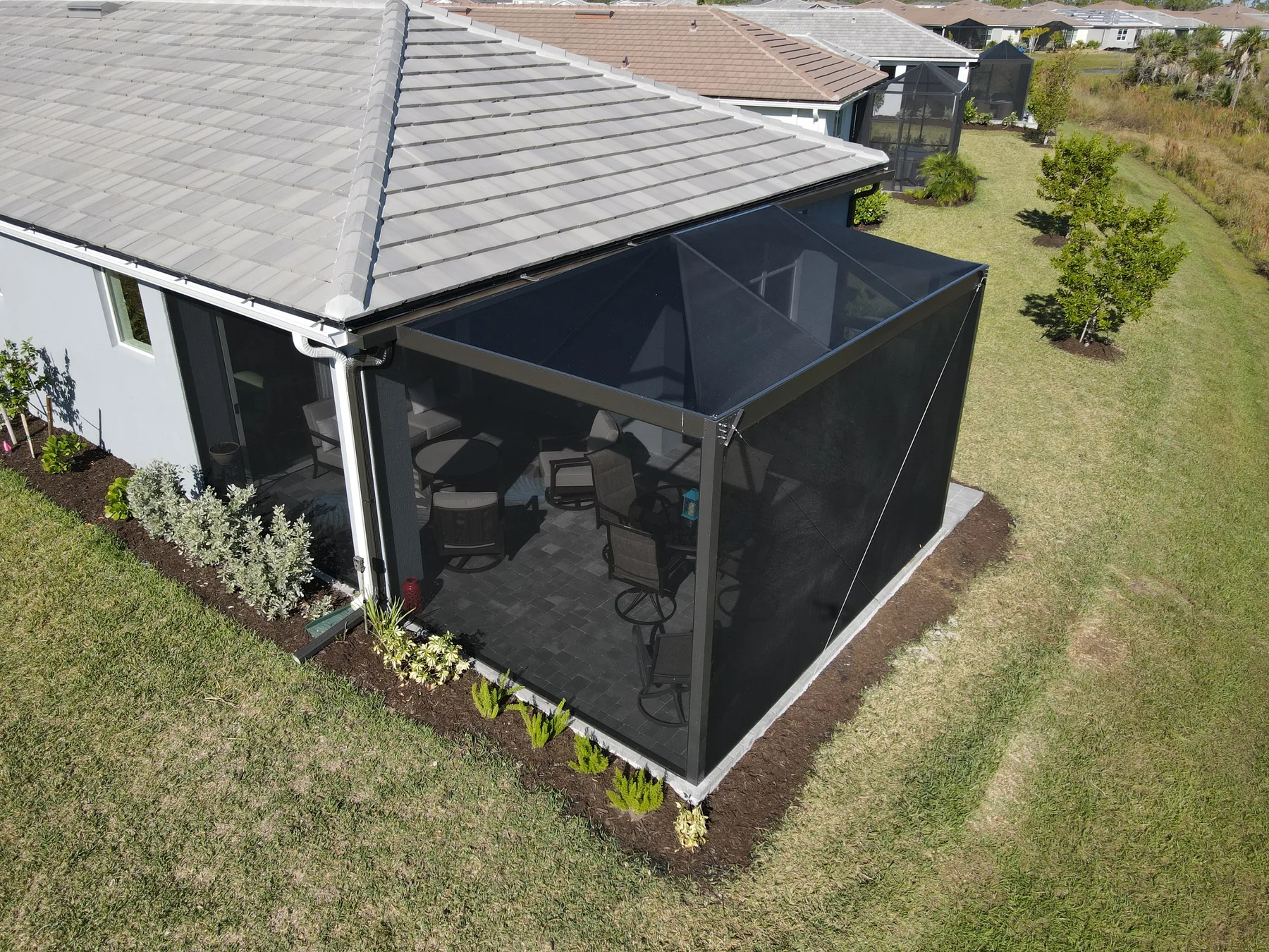Angled view of a compact screened patio enclosure